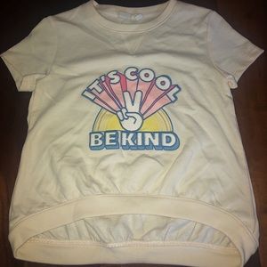 Never worn shirt w/ embroidered words and images.